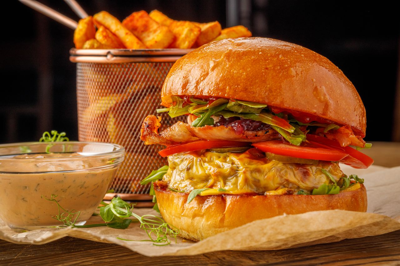 A cheeseburger with fries