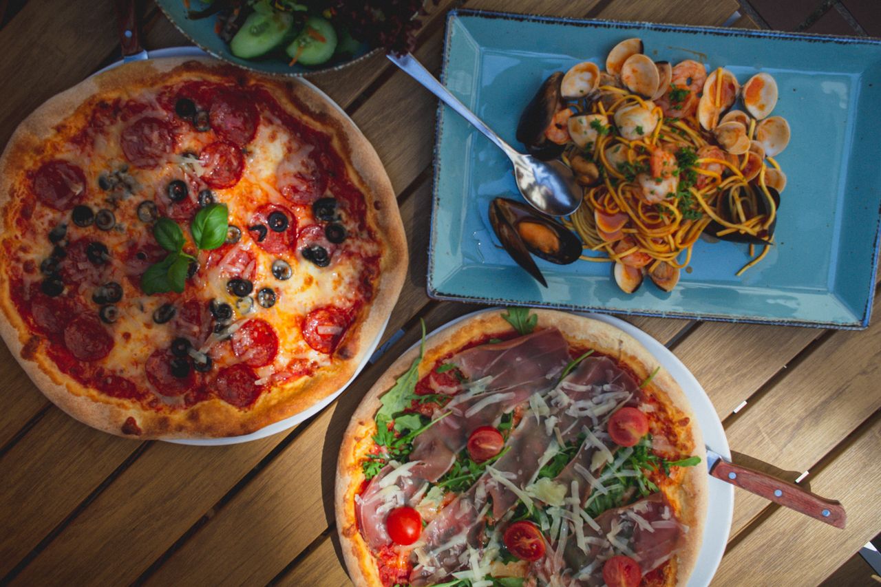 Pizza and pasta on a table